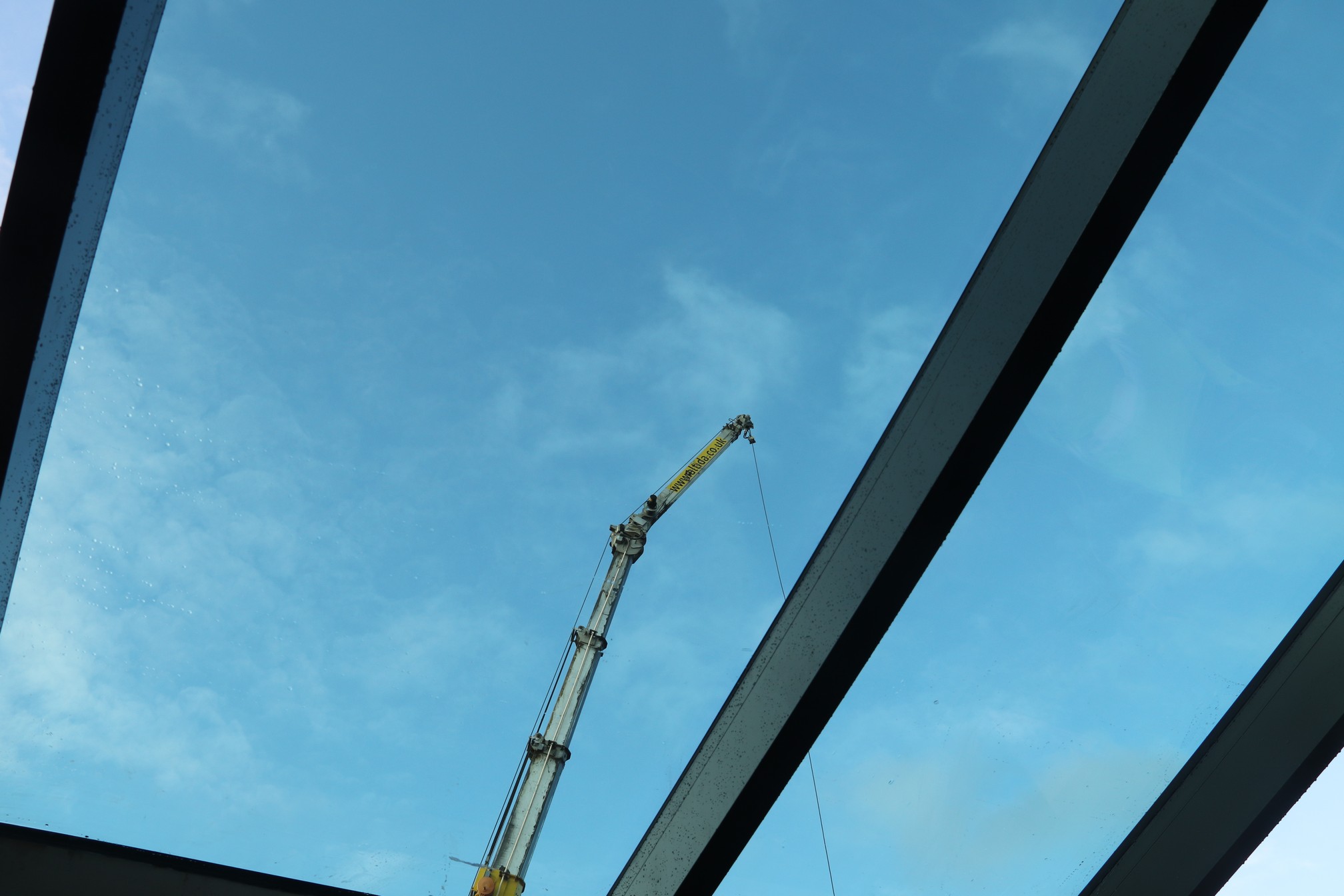 A photo showing the first few panes of glass installed in the roof at The Link Centre