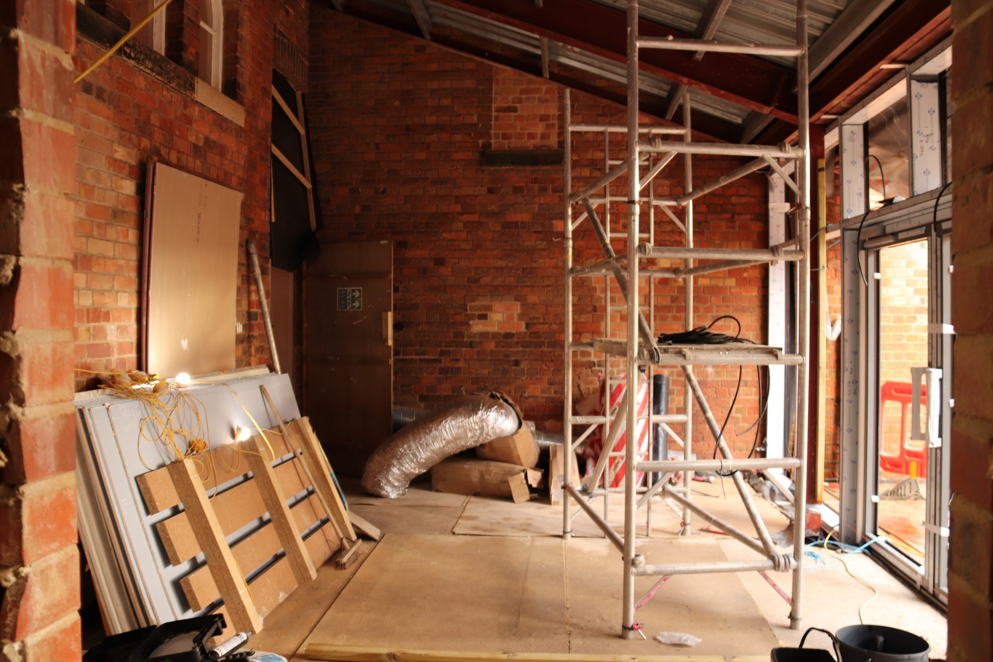 This is the new Gateway extension lounge area with the windows and patio doors being installed