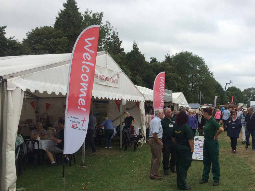 Photo of large marquee with red & white banners outside saying Ashbourne Methodist