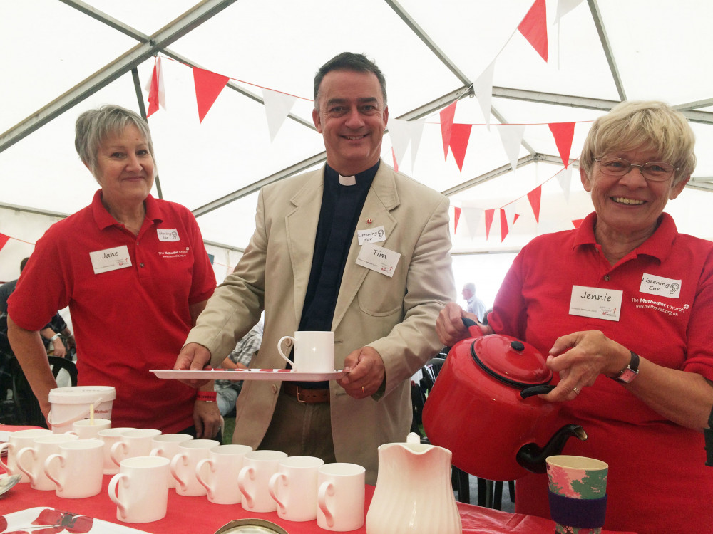 Photo showing 3 people smiling and serving drinks. One is the Minister of Ashbourne Methodist Church and Circuit